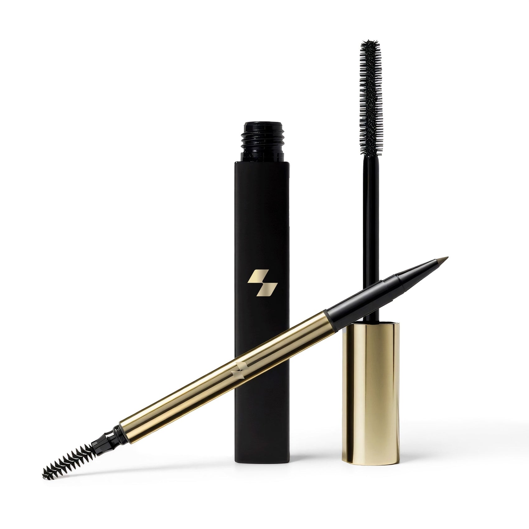 Eyebrow pencil and mascara with gold and black design on a white background