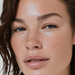 Close-up of a woman's face with natural makeup and brown hair (Medium brown)