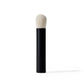 Makeup brush with black handle and white bristle head on a white background