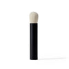 Makeup brush with black handle and white bristle head on a white background