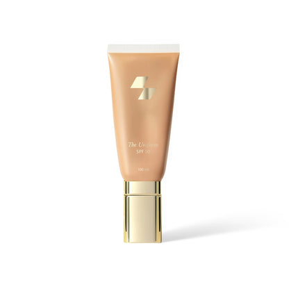 Cosmetic tube with gold cap on a white background (Beige)