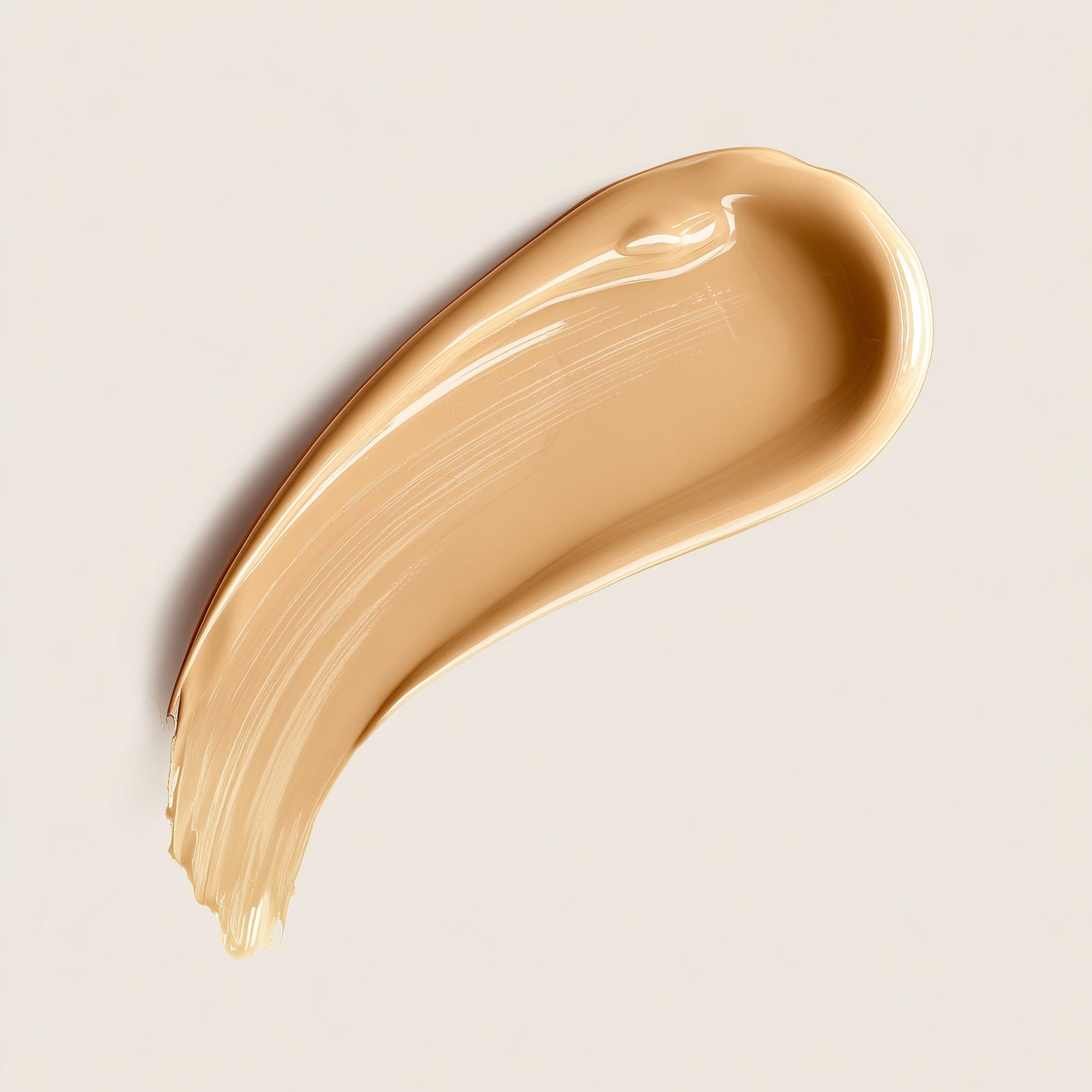 Beige cosmetic cream swatch on a light beige background