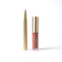 Lipstick with gold casing on a white background