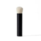 Makeup brush with black handle and white bristle head on a white background