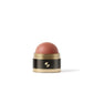 Cosmetic blush stick with black and gold packaging on a white background