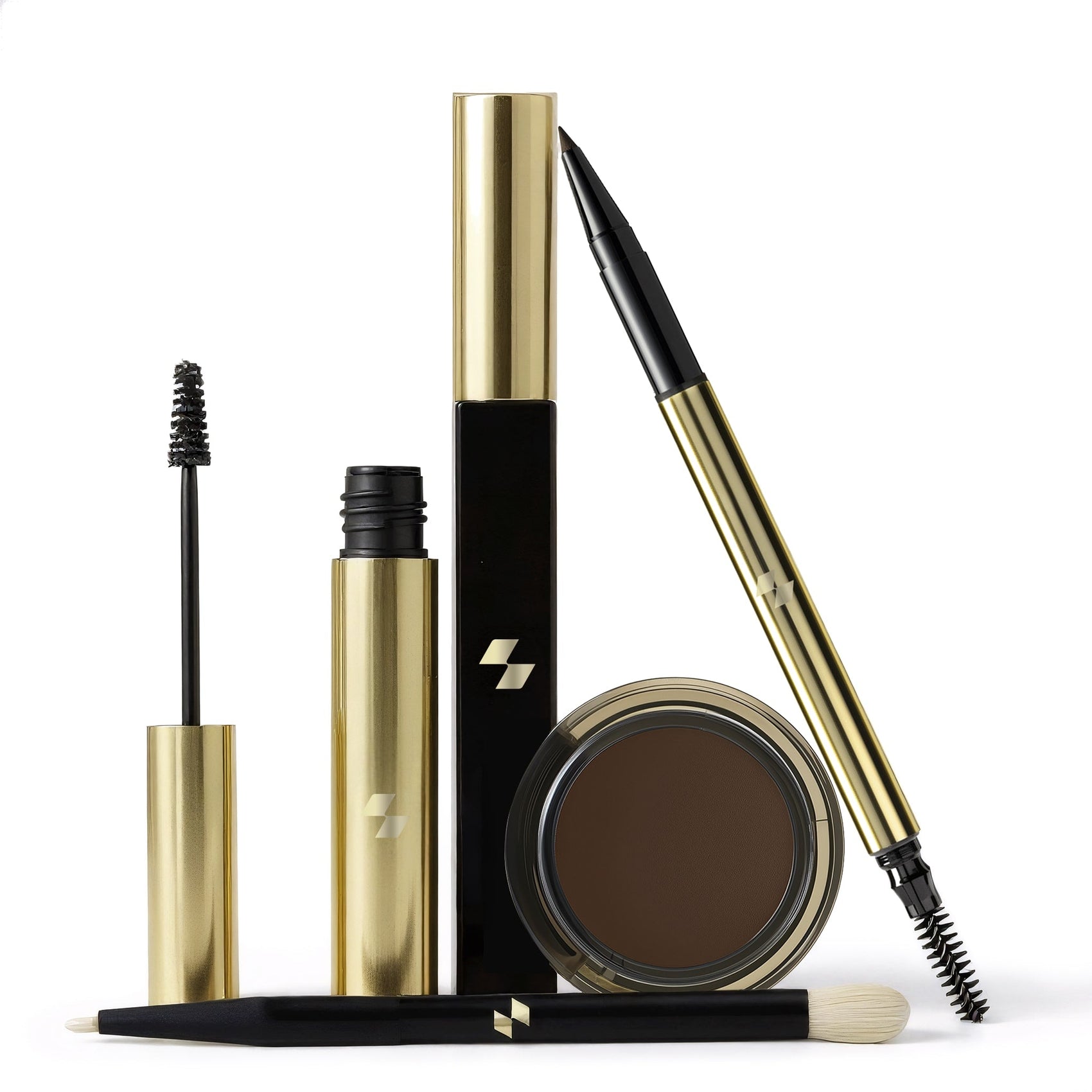 Set of makeup products including a brow pencil, brow powder, and mascara on a white background