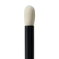 Makeup brush with black handle and white bristles on a white background