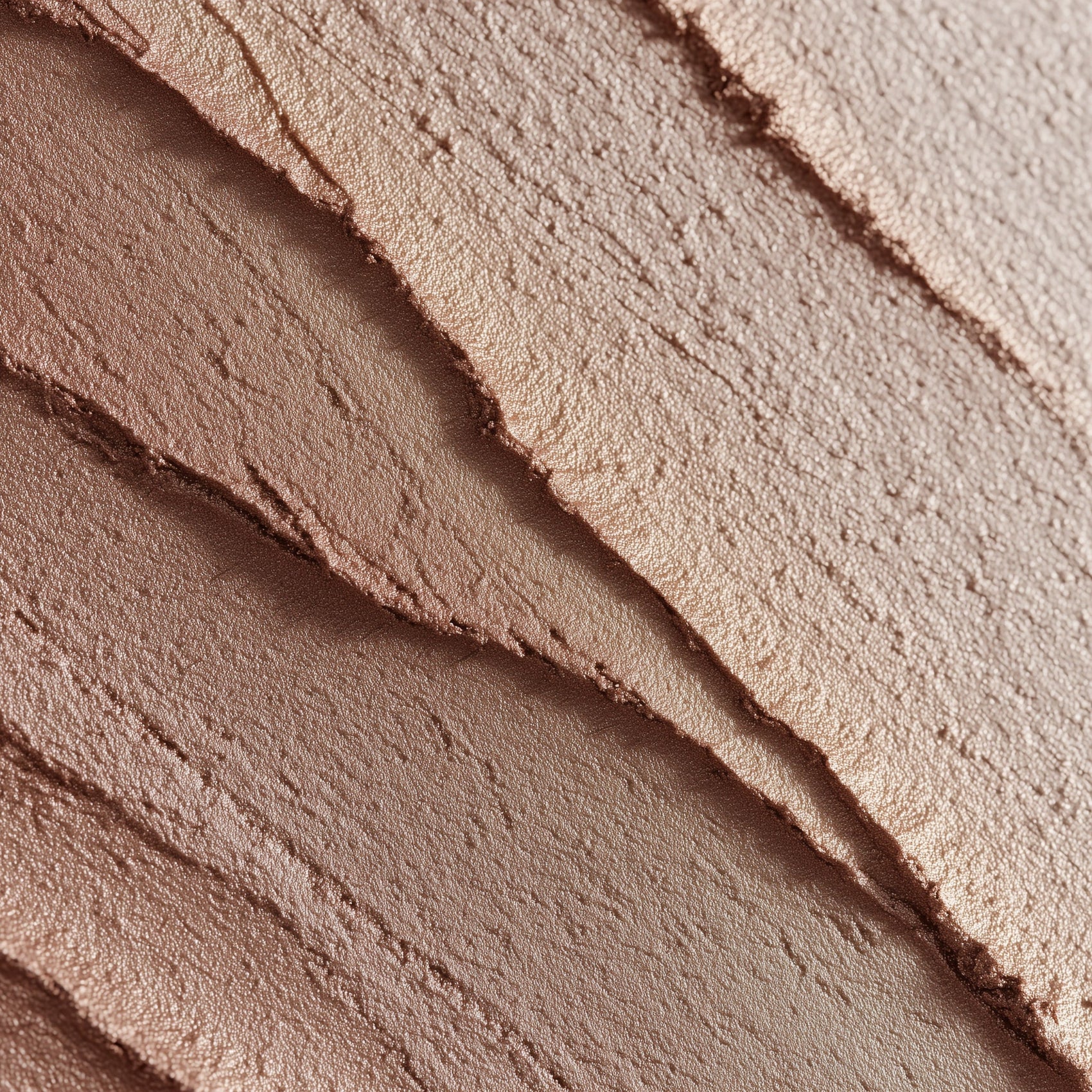 Close-up of layered makeup product with a gradient effect