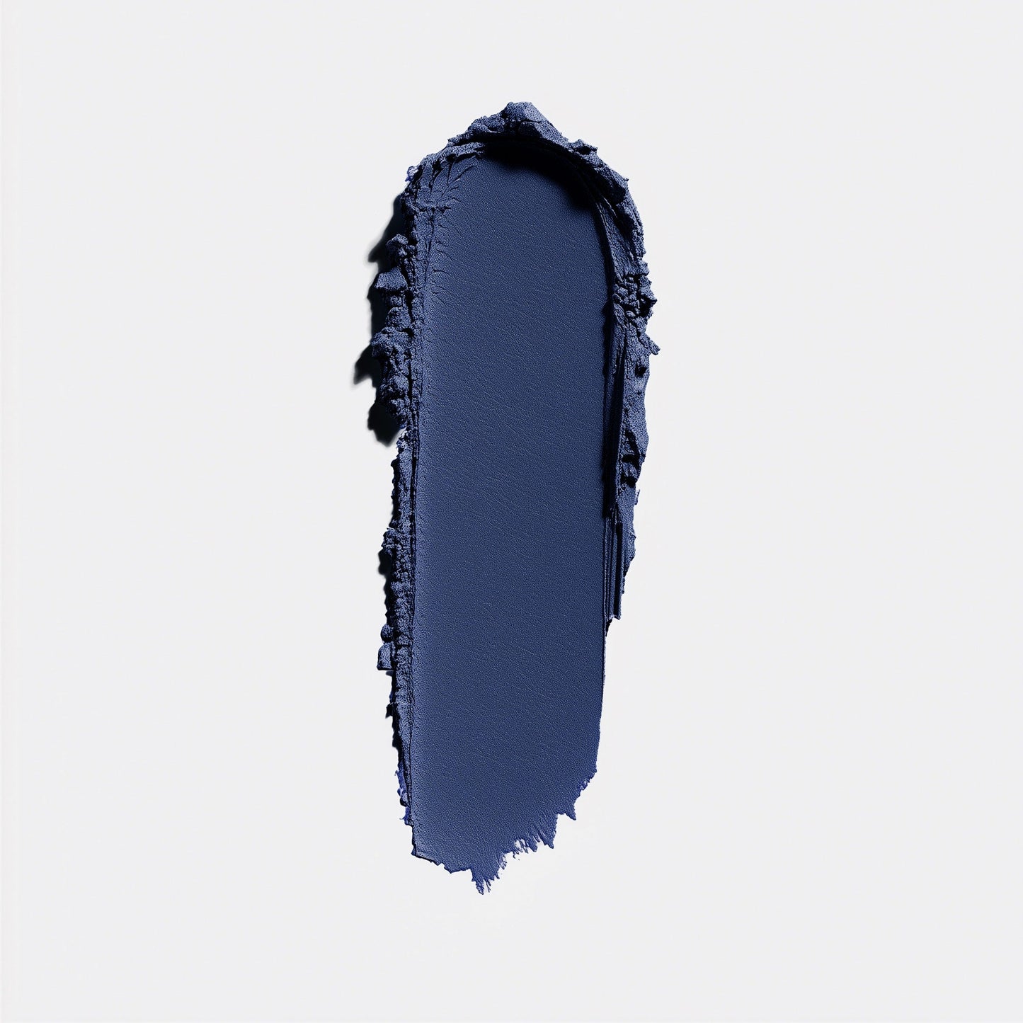 Navy blue makeup swatch on a light gray background (Blue)