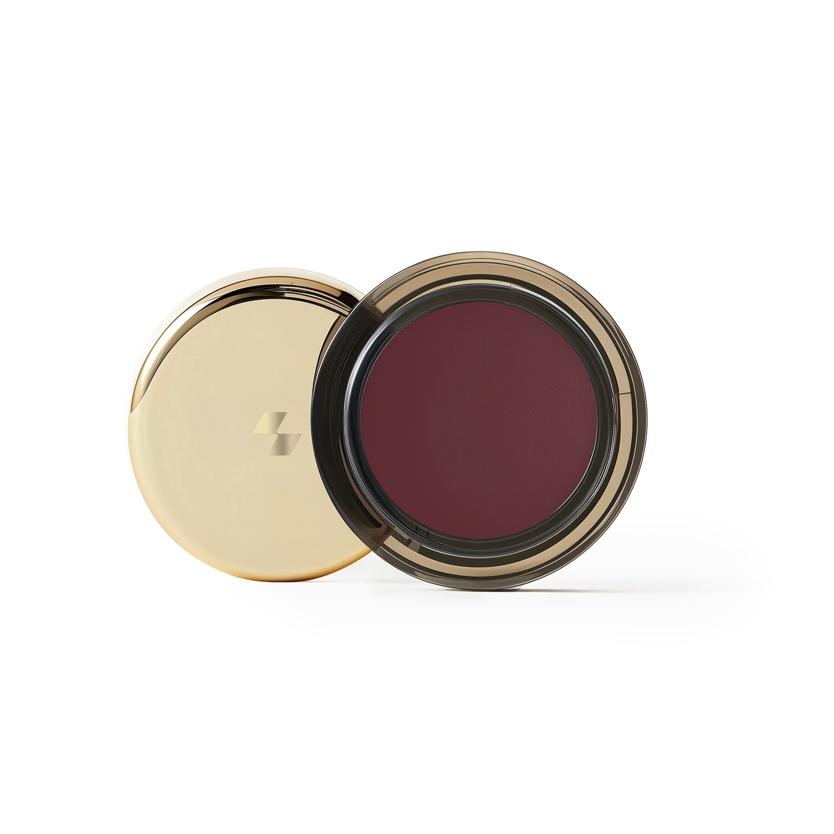 Cosmetic compact with gold lid and red interior on a white background (Marsala)