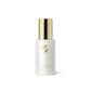 Skincare bottle with gold cap and logo on a white background