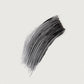 Black paint swatch on a light gray background