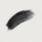 Black brushstroke on a light gray background