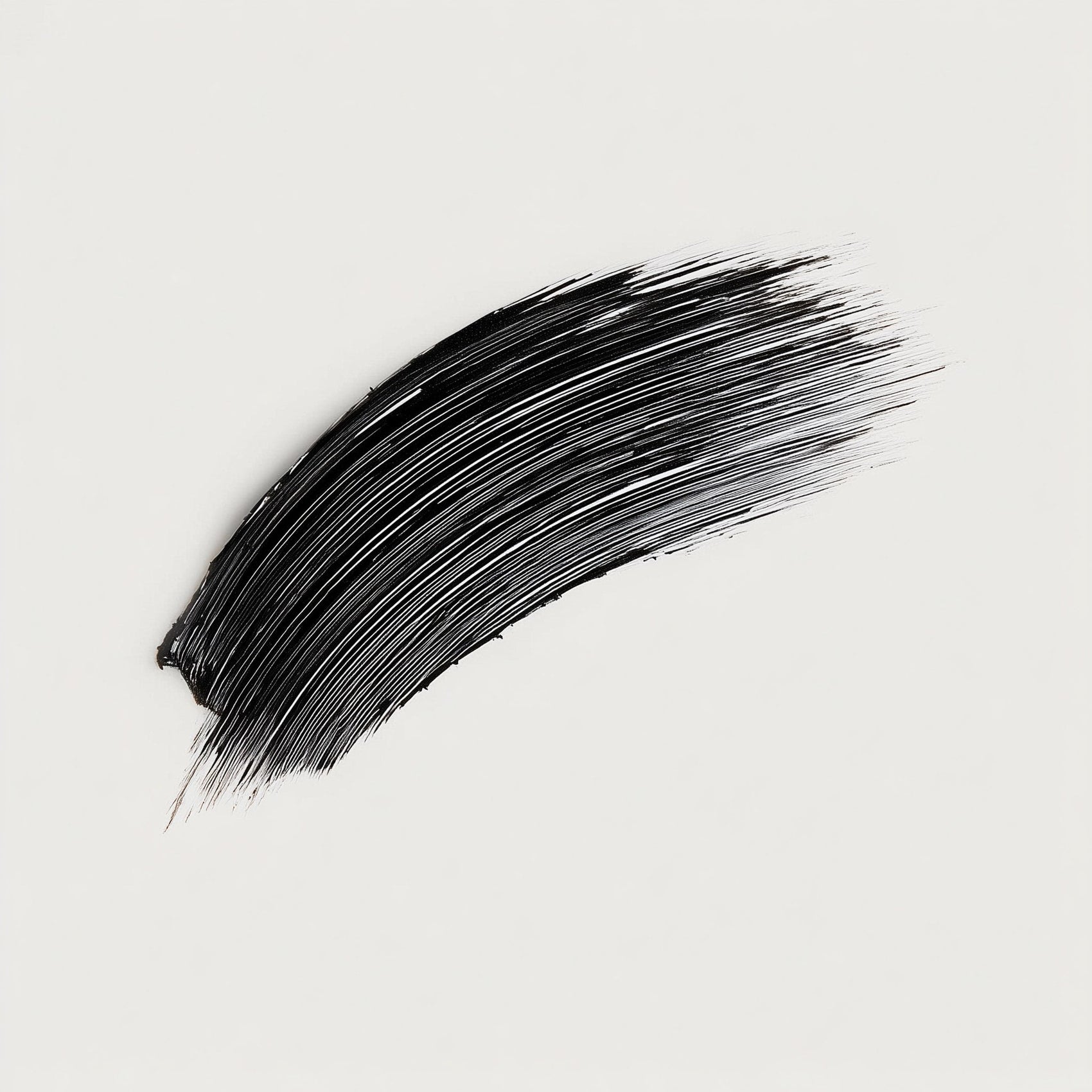 Black brushstroke on a light gray background