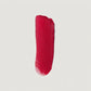 Red lipstick swatch on a light gray background (Neon Red)
