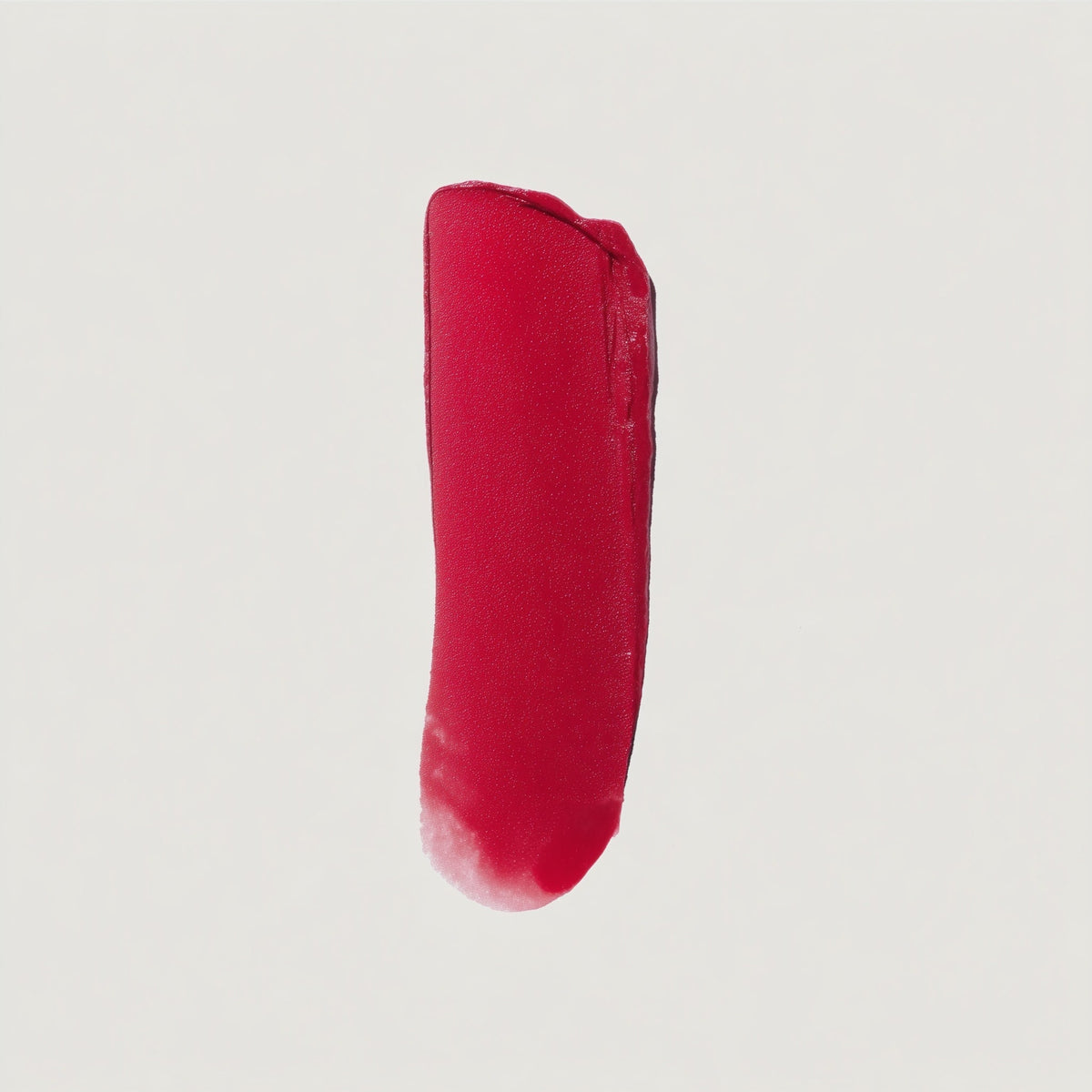 Red lipstick swatch on a light gray background (Neon Red)