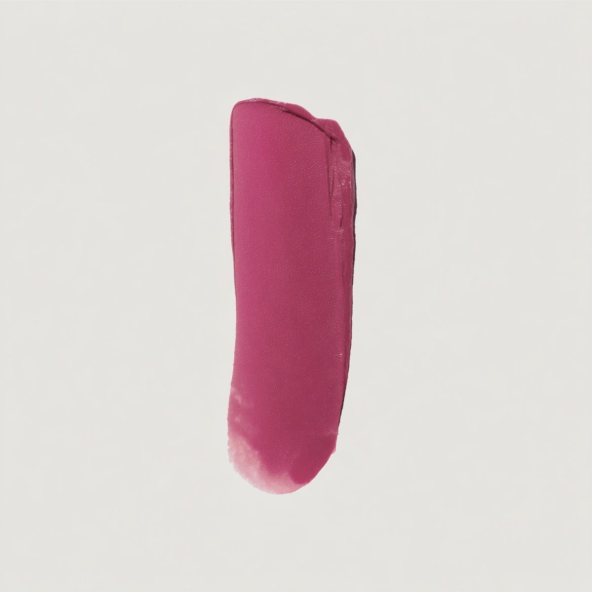 Pink lipstick swatch on a light gray background (Pink)