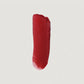 Red lipstick swatch on a light gray background (Red)