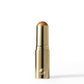 Gold lipstick with a brown cap on a white background