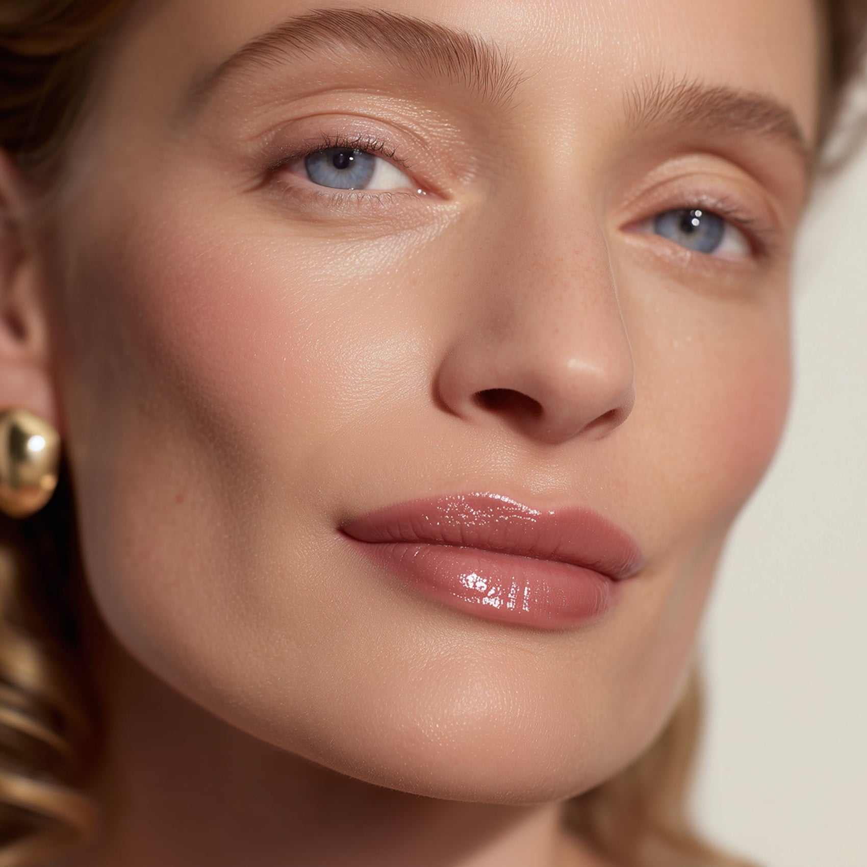 Close-up of a woman's face with a soft focus on her eyes and lips  (Medium Orange)