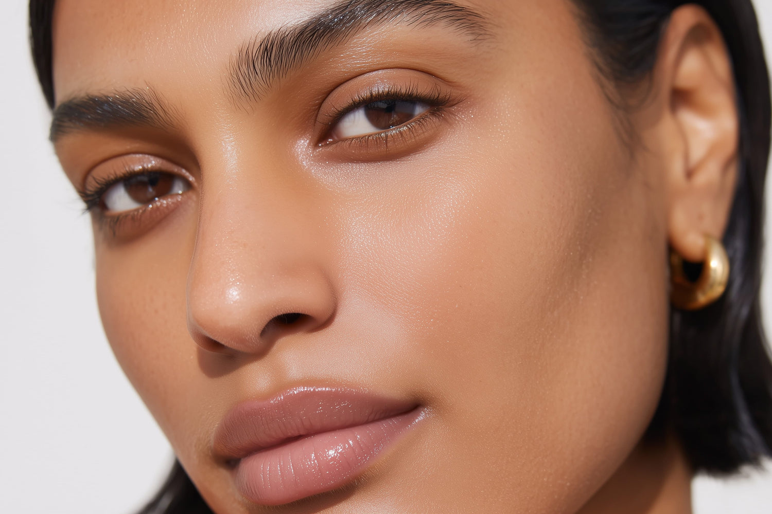 Close-up of a person's face with a neutral background