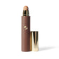 Cosmetic stick with a brown shade and gold cap on a white background (Beige)