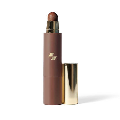 Cosmetic stick with brown shade and gold cap on a white background (Brown)