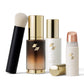 Set of skincare products including bottles and a brush on a white background